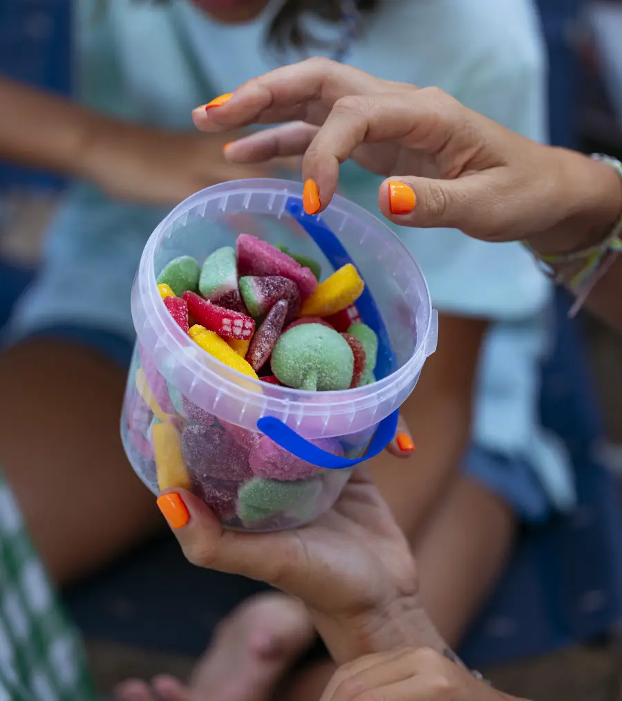 family eating candy on a happy picnic