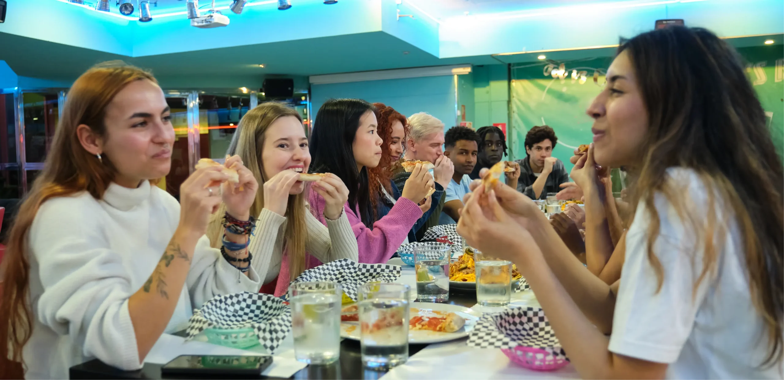group of students enjoying pizza together